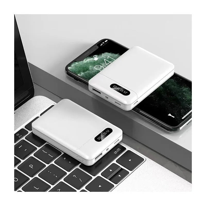 Black and white plastic power bank with dual USB ports showing 92x63x23mm dimensions