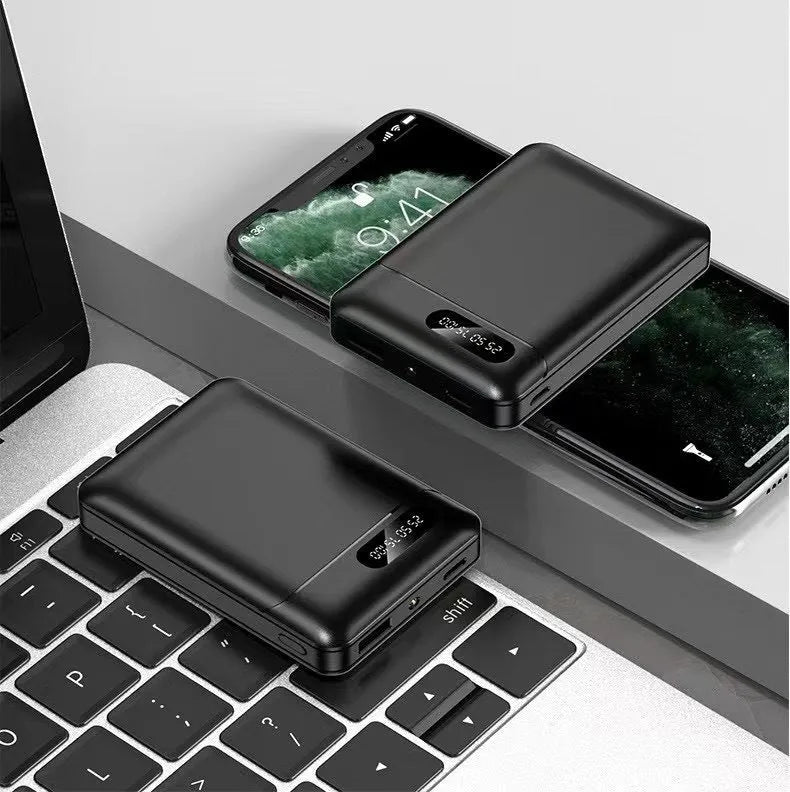 Black and white plastic power bank with dual USB ports showing 92x63x23mm dimensions