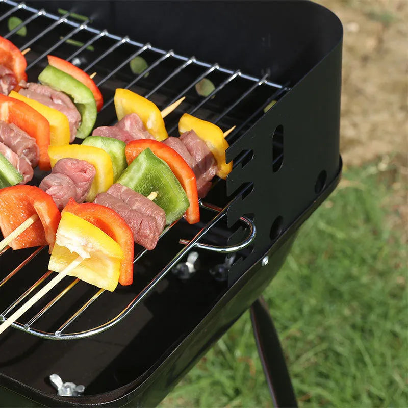 Portable metal barbecue grill, 29x12x44cm, with black grill rack disk for camping and outdoor use
