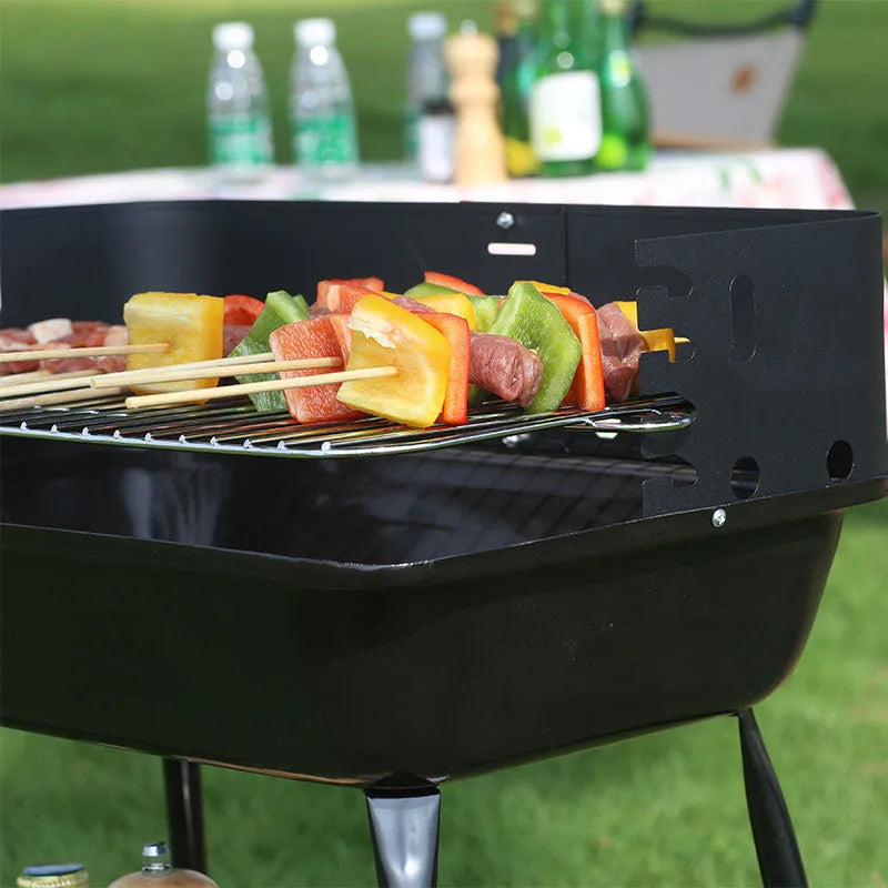 Portable metal barbecue grill, 29x12x44cm, with black grill rack disk for camping and outdoor use