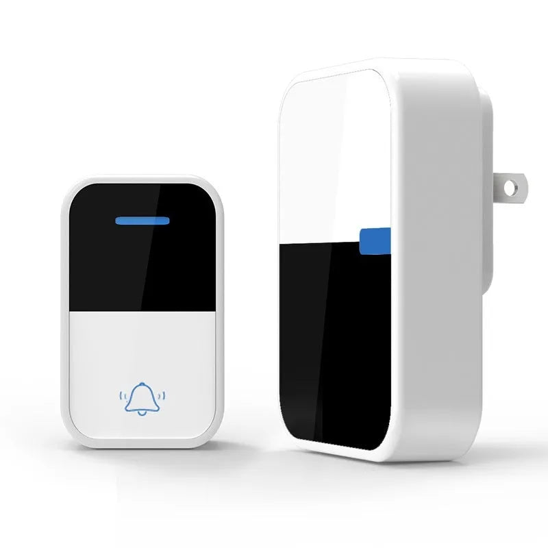 White wireless doorbell kit with plug-in chime and push button on a wooden table