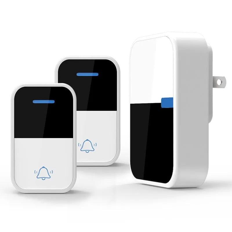 White wireless doorbell kit with plug-in chime and push button on a wooden table