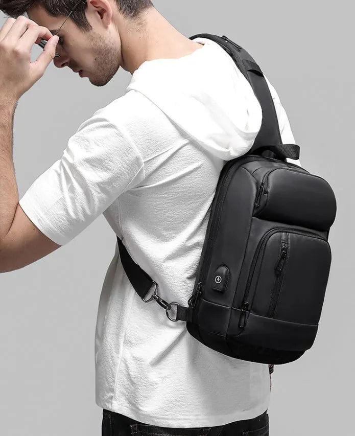 Black medium outdoor leisure shoulder bag showing square shape and single air cushion strap