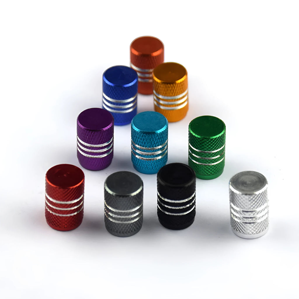 Set of aluminium alloy tyre valve caps in various metallic colours including red, blue, black, gold and silver.