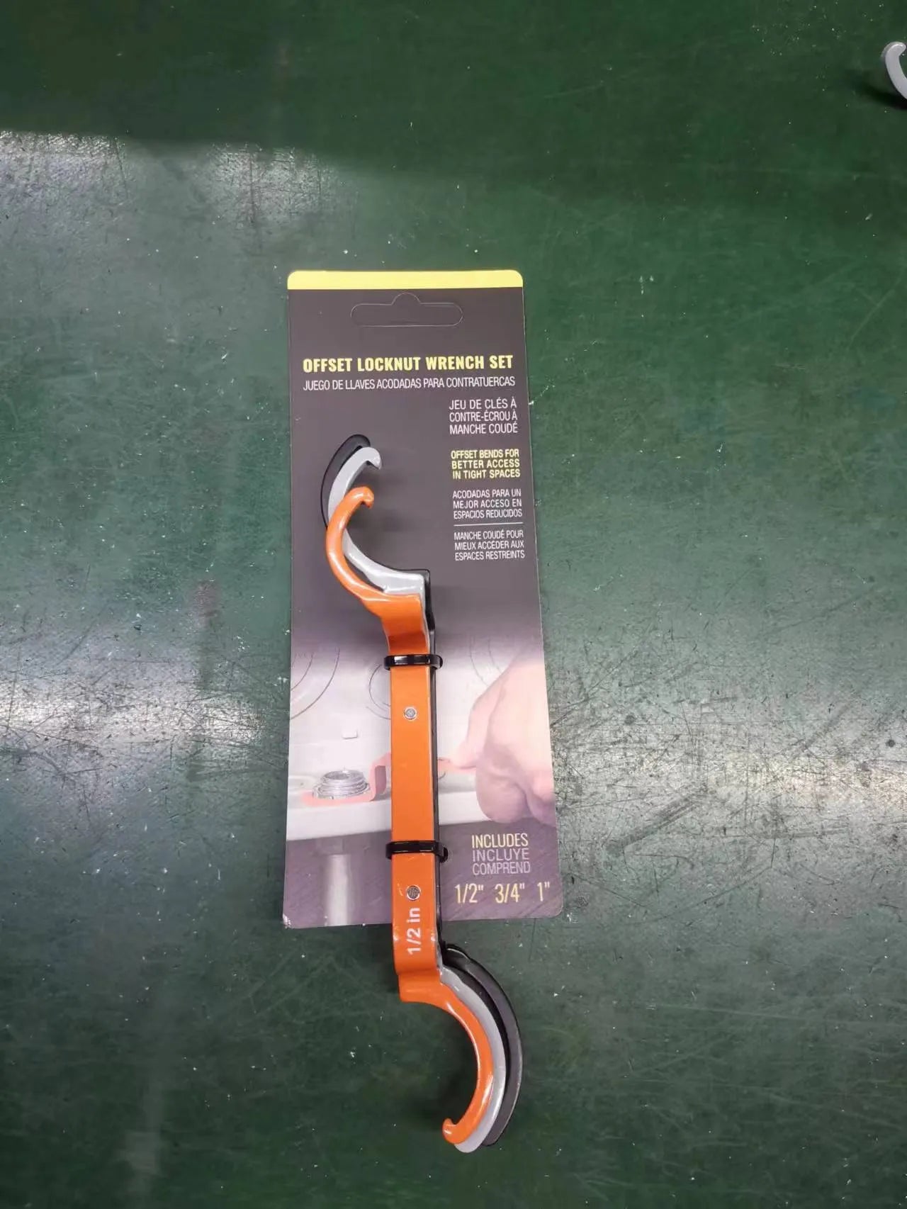 Orange, grey, and black magnetic crescent wrenches with catheter locking, shown together as a three-piece set.
