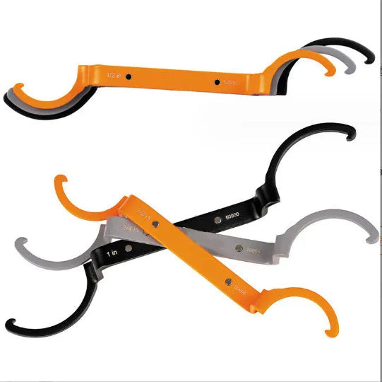 Orange, grey, and black magnetic crescent wrenches with catheter locking, shown together as a three-piece set.