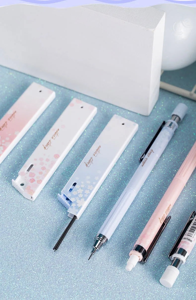 Sakura law style cartoon automatic pencil set with three 0.5mm pencils and HB refill boxes.