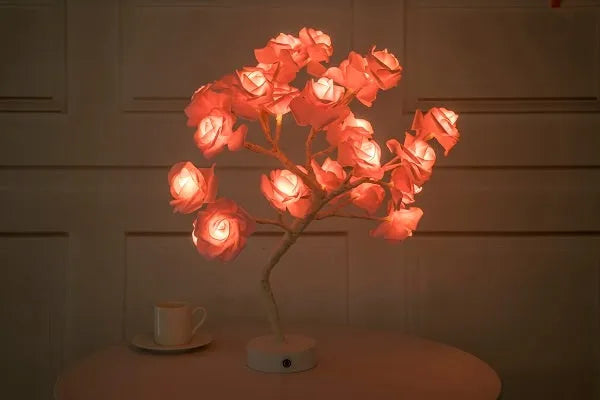 White and red PE cotton rose flower lamp with warm white LED lights on a table, with battery and USB power options.