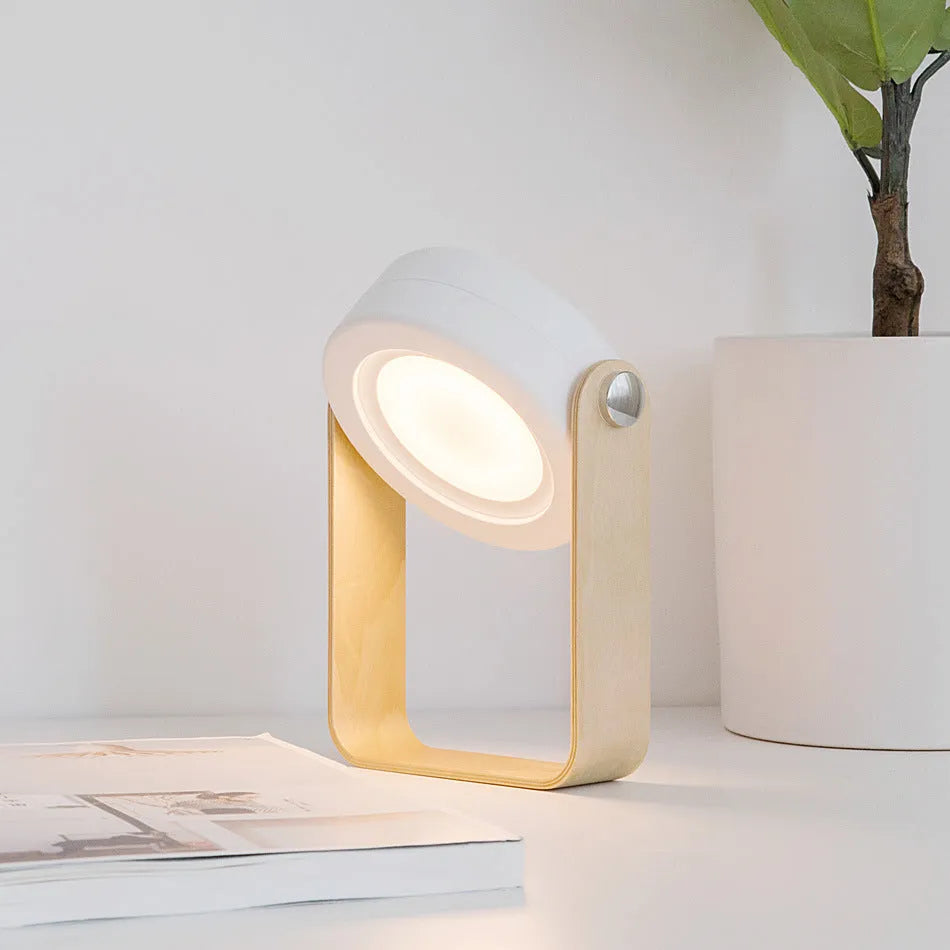 White foldable LED night light in both table lamp and tall lantern configurations, with USB cable.