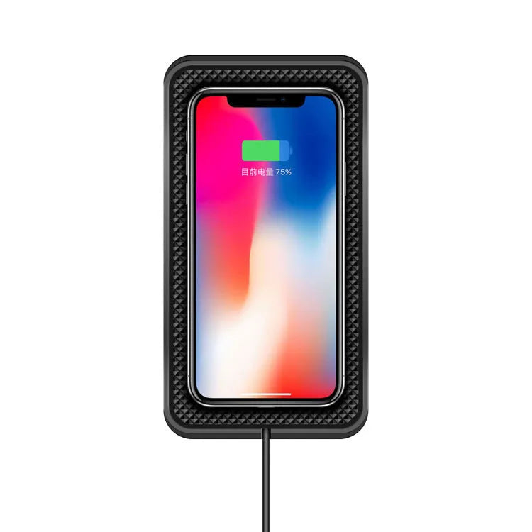 Black wireless car charger with anti-slip base, shown on a car dashboard next to a mobile phone.