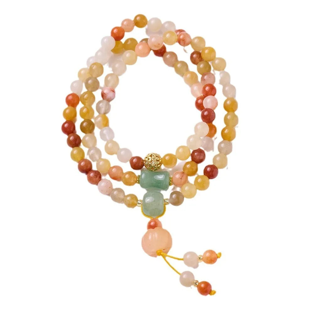 Women's handcrafted Jinsi Jade bracelet with three pumpkin circles and tassel decoration