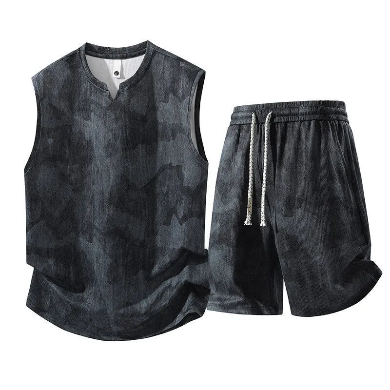 Men's black-blue sleeveless vest suit with matching fifth-length shorts on a hanger.