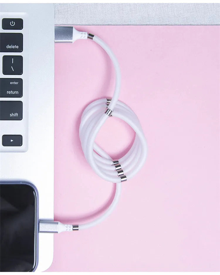 Black magnetic charging cable with multiple connector heads including USB-C, Micro USB and Apple-compatible 3.5mm