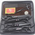 Pet grooming scissors set with straight, curved, and texturing blades in black stainless steel