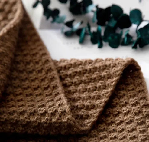 Nordic-style fringed knit acrylic blanket in beige, measuring 130 by 170 centimetres.