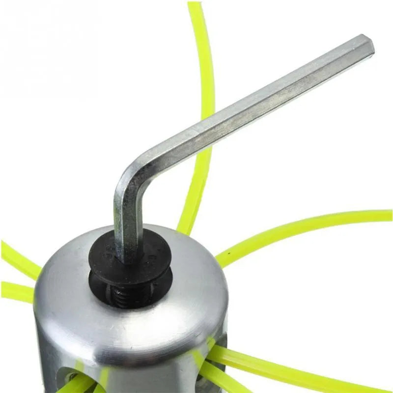 Silver aluminium lawn mower trimmer head with four light yellow grass lines, wrench, and gasket.