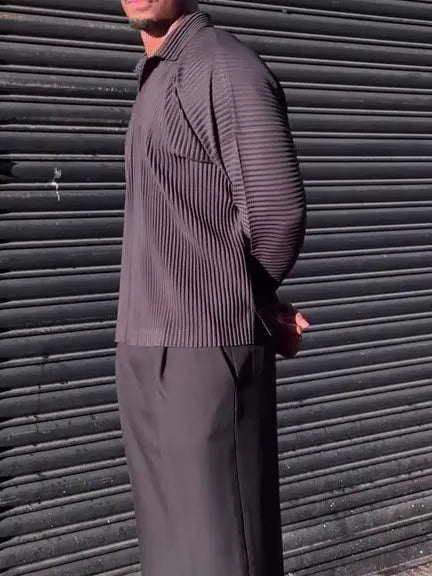 Black men's long-sleeved casual top with pleated detail on the sleeves.