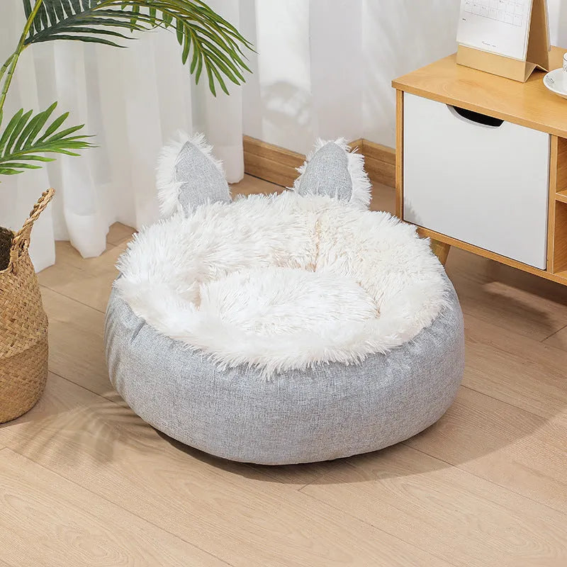 Soft faux fur plush cat bed in grey with fluffy interior – available in multiple sizes and colours for indoor use