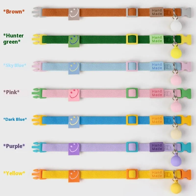 A small, high-elasticity polyester dog collar in a monochrome colour, showing the plastic buckle and adjustable strap.