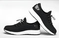 Black low-cut safety shoes with steel toe cap, flying net upper, ventilation holes, anti-skid sole, sizes 36-46.
