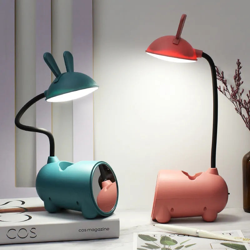 Cartoon-themed USB desk lamp with pen container in dark blue, green, or pink colours