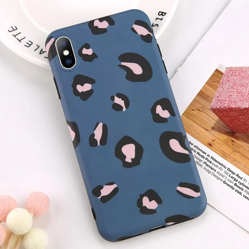 Leopard print pattern phone case for iPhone, shown in black, blue, and pink colour options.