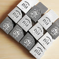 Three rolls of decorative paper tape showing lattice, wave point and weave patterns for craft projects