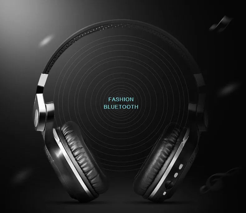 Black Bluetooth headset folded and inserted into its rectangular card-style storage plug-in.