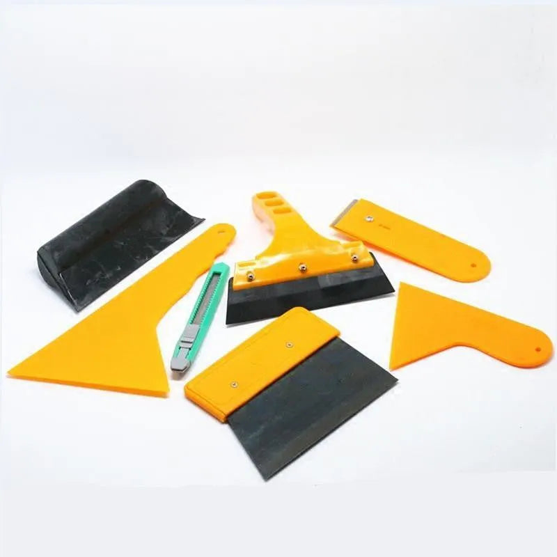 Seven-piece car film application tool set with scrapers, knives, and a pressing block.