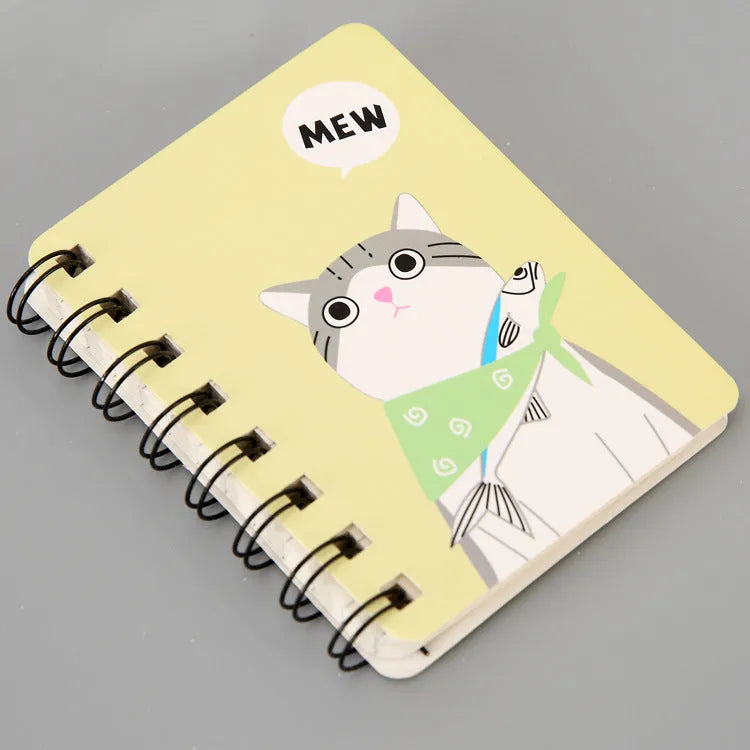 Mini spiral notebook with pen in green, pink, purple, or yellow colours showing 50 pages and 80x105mm size