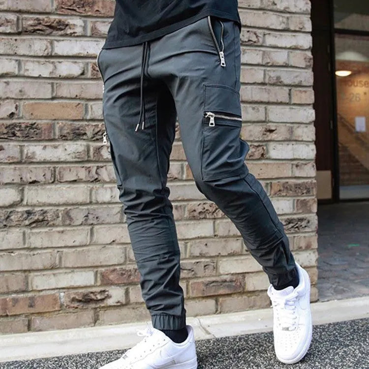 Men's zipper multi-pocket loose casual trousers in black with adjustable belt and small leg opening