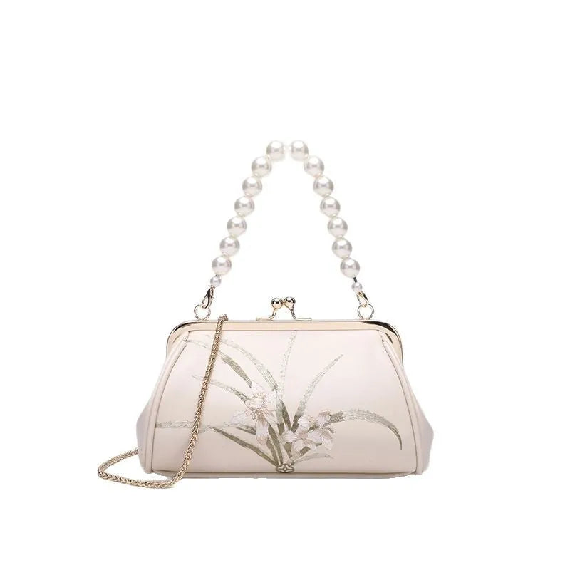 Beige women's shoulder bag with embroidery on soft PU leather in shell shape