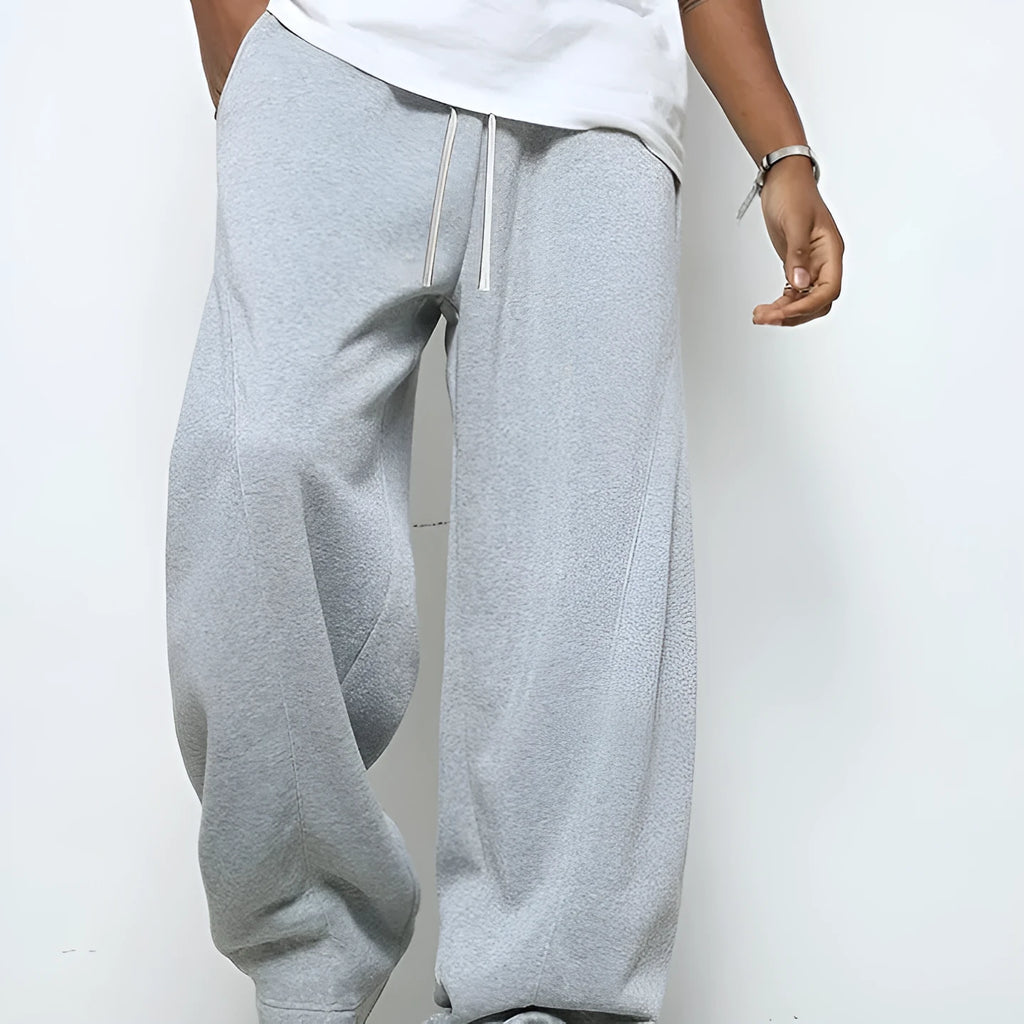 Men's straight-leg casual trousers in dark grey with a drawstring waistband.