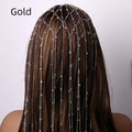 Gold and silver rhinestone headband with decorative tassel detail on mesh base