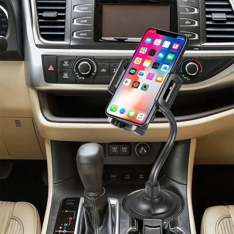 Black universal car phone holder with adjustable wings shown mounted on a car vent.