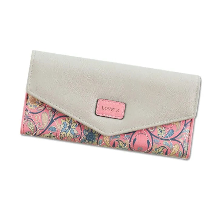 Women's black three-fold PU leather wallet with a metal clip, showing its open large capacity interior.
