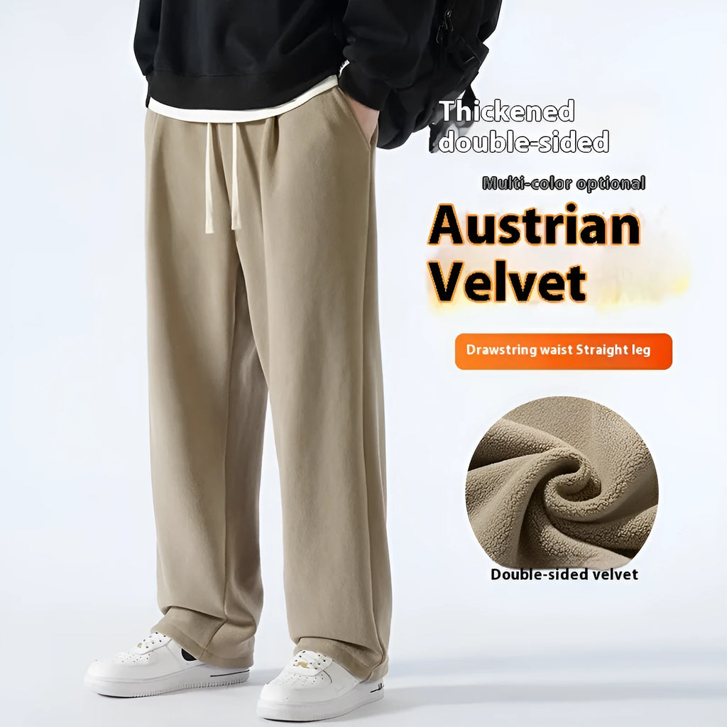 Men's apricot fleece-lined casual sports trousers with a loose fit and drawstring waist, laid flat.