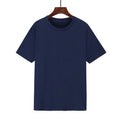 Men's black loose-fit cotton T-shirt with a short sleeve and screen-printed design on a hanger.
