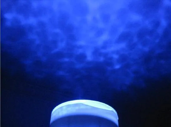 Blue fixed-mount ocean projection lamp for children's puzzle activities.
