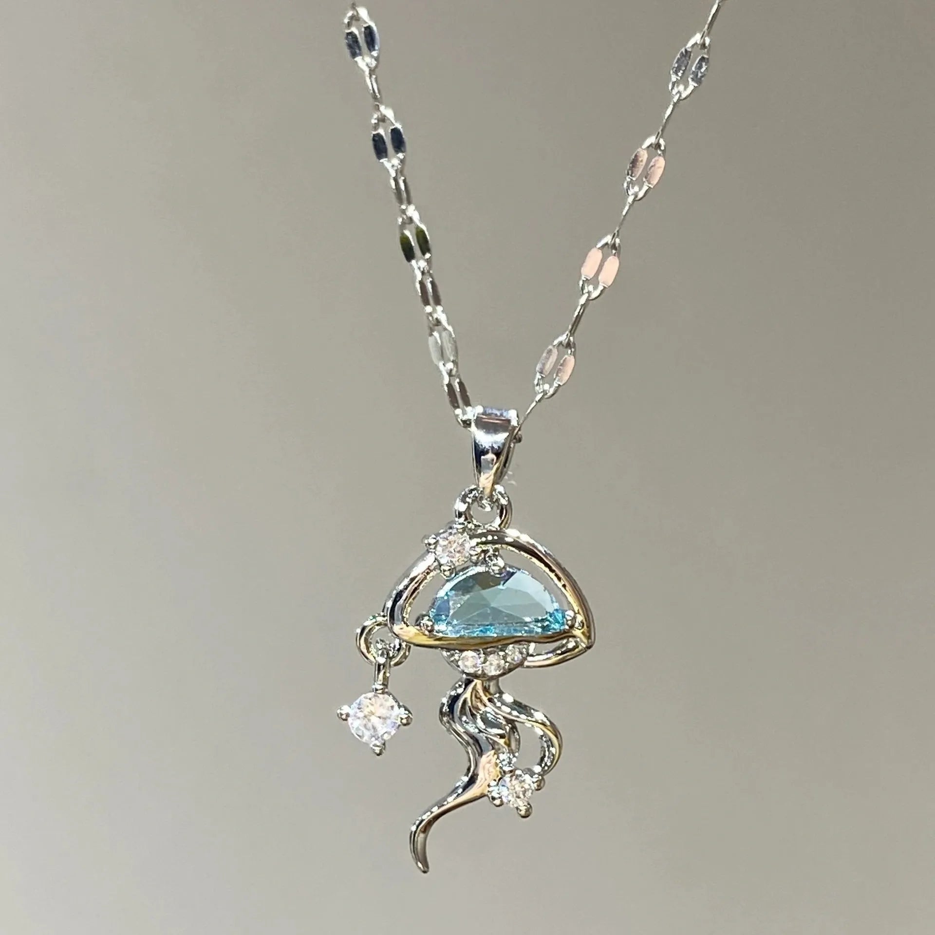 S925 sterling silver blue jellyfish necklace with adjustable chain on white background