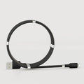 Black magnetic charging cable with multiple connector heads including USB-C, Micro USB and Apple-compatible 3.5mm