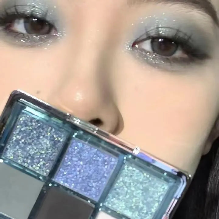 MUGELEEN nine-colour eye shadow palette showing matte and shimmer finishes in low saturation tones