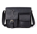 Brown full-grain leather vintage messenger bag with brass buckle, shown open to reveal padded laptop sleeve and internal pockets.