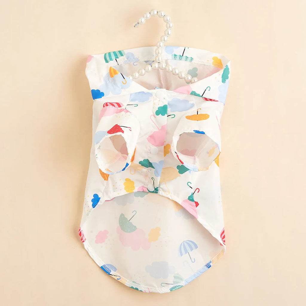 Colourful cartoon umbrella pattern dog raincoat made from polyester fabric.