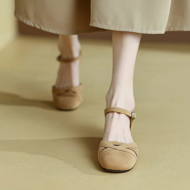Women's apricot retro Roman sandals with a buckle closure and round toe on a light background.