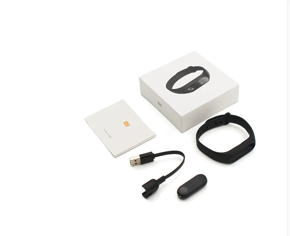 Xiaomi Mi Band 2 black fitness tracker with OLED screen on an adjustable wrist strap.