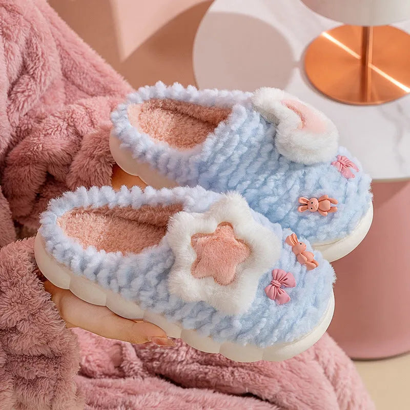 Light blue women's plush slippers with an animal pattern on the round toe holder and a thick fleece lining.