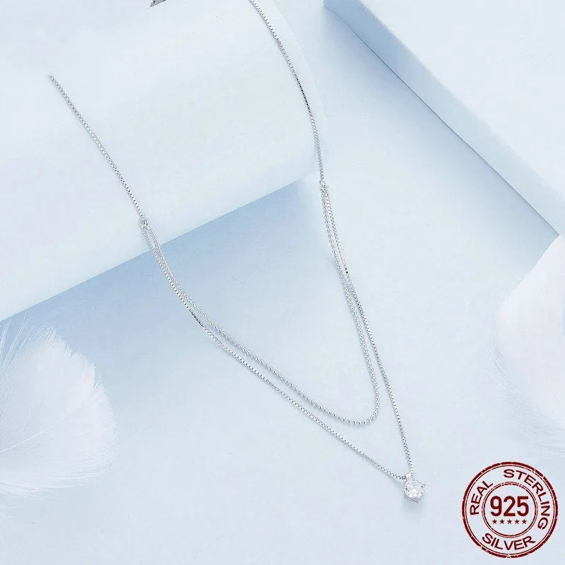 Double-layer sterling silver necklace with pearl chain and adjustable clasp