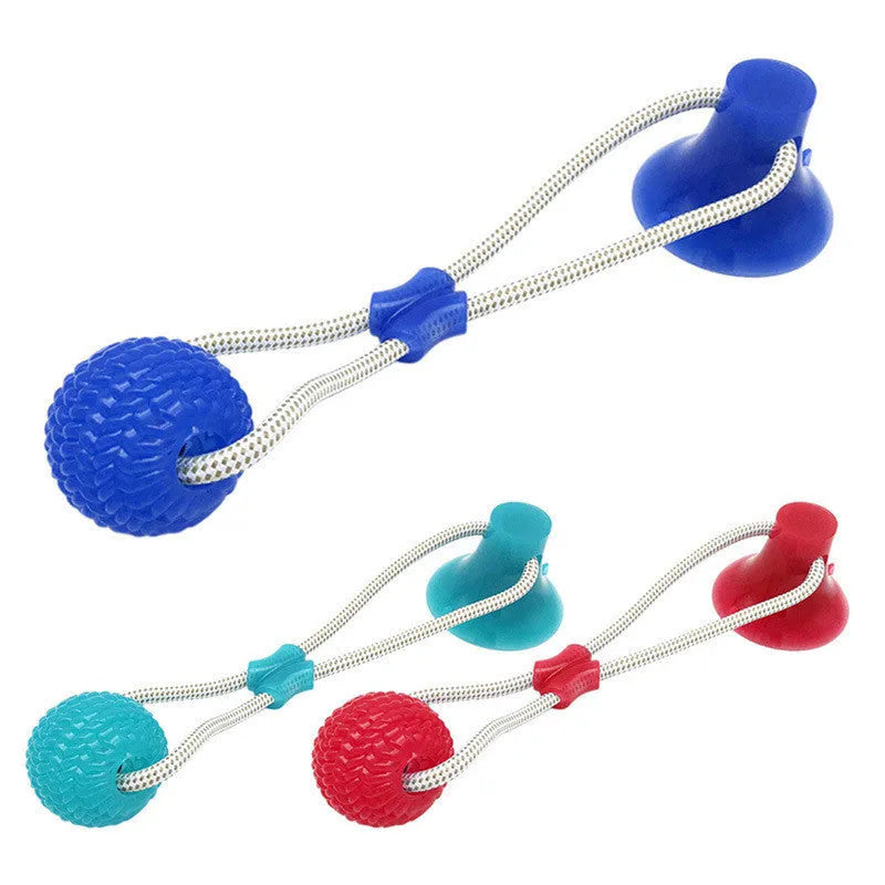 Pet dog rubber sucker molar toy in red colour on smooth surface