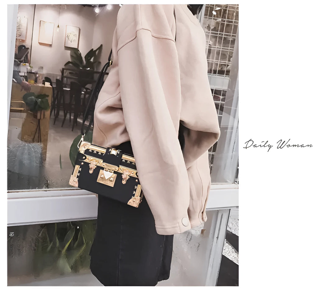 Women's structured black PU shoulder bag with flap and adjustable crossbody strap